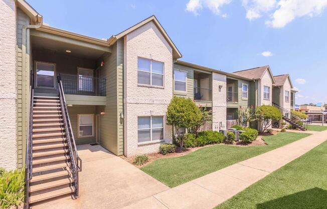 Exterior view of The Avenue apartment buildings and landscaping