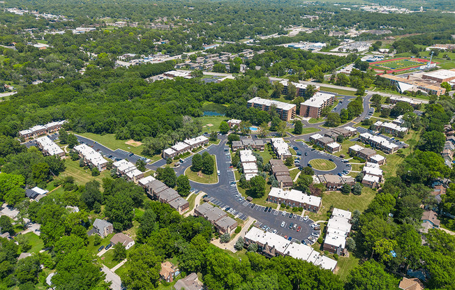 an aerial view of a city with buildings and trees