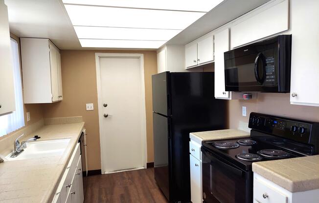 a large kitchen with stainless steel appliances