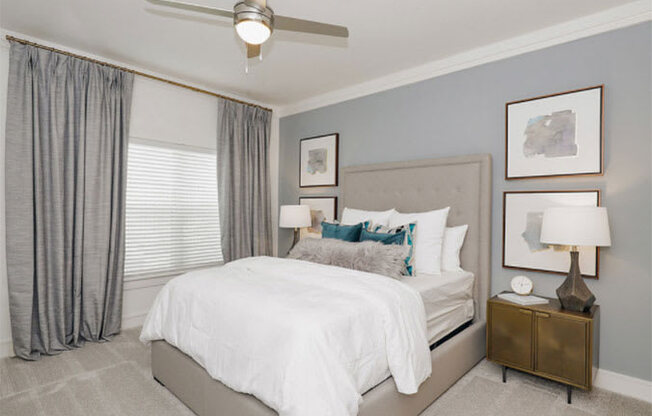 Bedroom With Ceiling Fan at Cue Luxury Apartments, Cypress