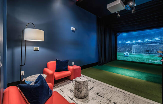 a game room with a soccer field and a projector at Altis Grand Suncoast, Florida, 34638