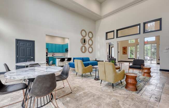 the reserve at bucklin hill clubhouse with tables and chairs and a kitchen in the background