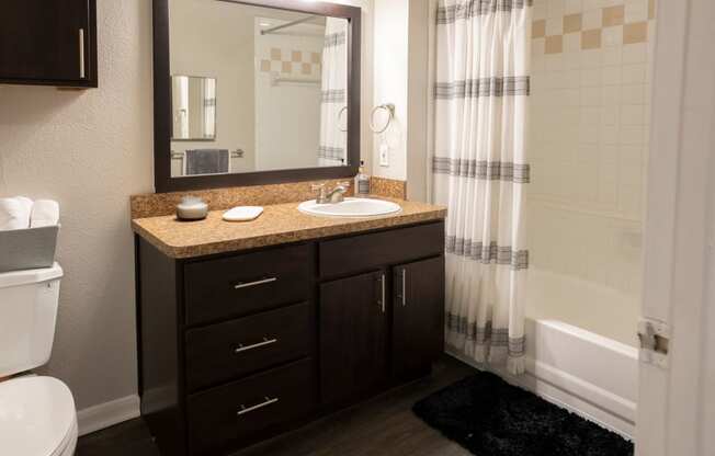 Modern Bathroom with Framed Mirror  located at Retreat at Steeplechase in Houston, TX 77065