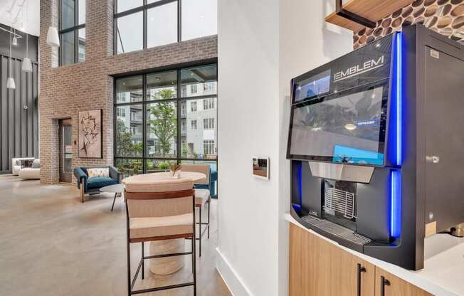 a living room with a refrigerator and a table with chairs