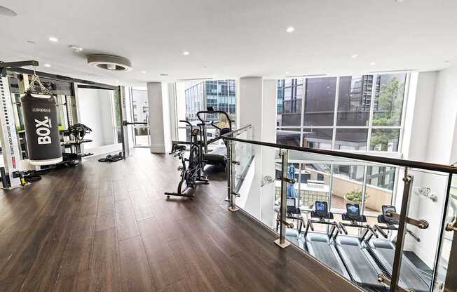 A gym with a view of the city.