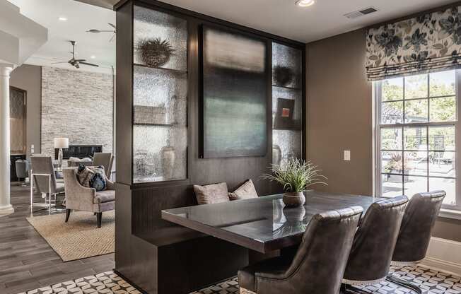 a dining room with a table and chairs