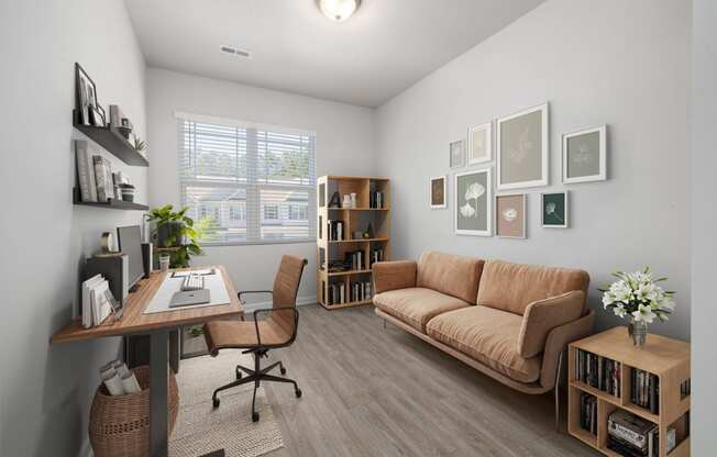 a living room with a couch and a desk