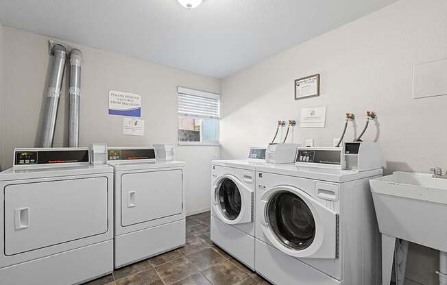 A row of washing machines in a laundromat.