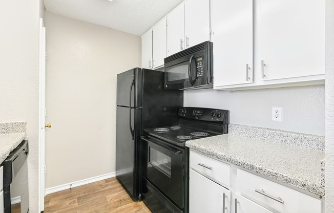 Brookstone Unit Kitchen at Bookstone and Terrace Apartments in Irving, Texas