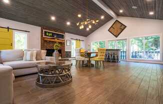 A modern living room with a white sofa and a coffee table.