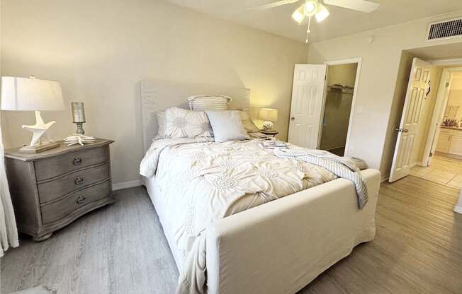 a bedroom with a bed and a closet