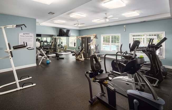 a room filled with lots of different types of exercise equipment