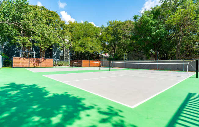 a rendering of a tennis court in a backyard with trees