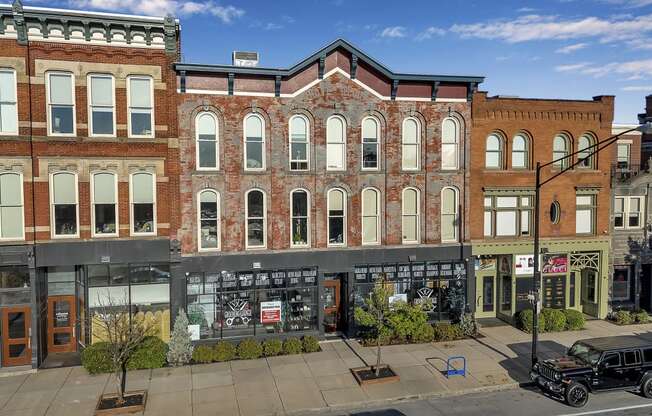 a large brick building on the corner of a city street