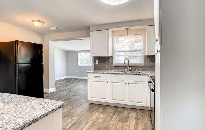 Completely upgraded 3/1 1196 Sq. Ft. with recently renovated bathroom and kitchen with GRANITE& a large open floor plan!!!