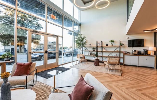 A modern living room with a couch, chairs, and a coffee table.