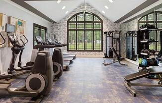 a gym with treadmills and other exercise equipment at Trails at Short Pump Apartments, Richmond, VA