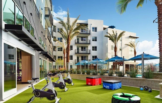 a group of exercise equipment in the middle of an apartment building