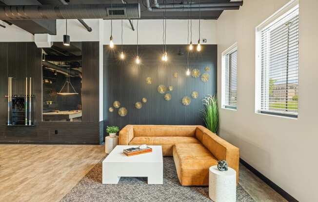 a living room with a brown couch and a white coffee table at EagleRidge Plaza Residences, North Dakota, 58104