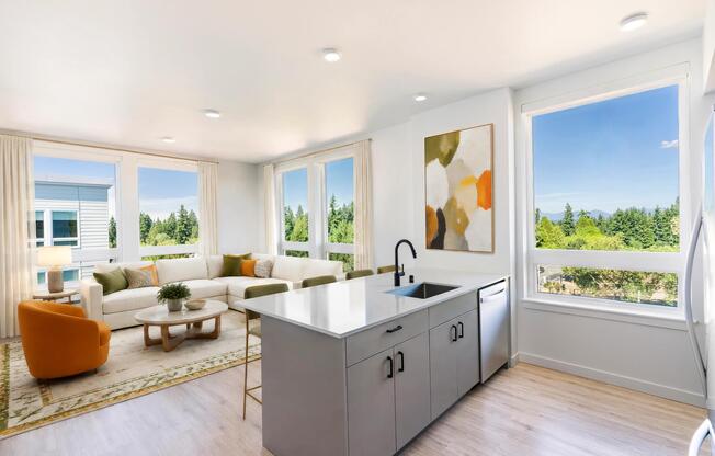 Open-concept layouts feature spacious kitchen islands, oversized windows, and scenic treetop views that bring natural light and a sense of openness into the home.