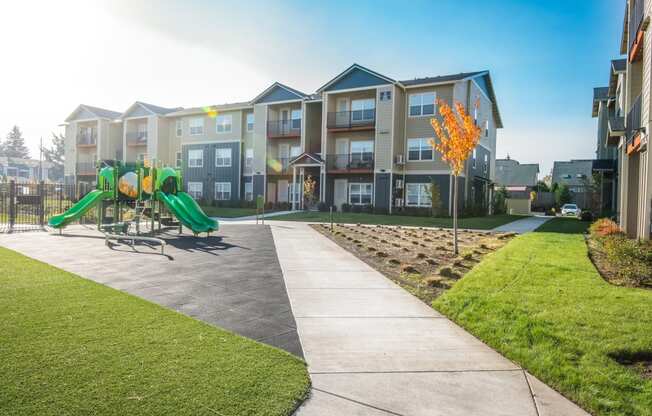 the preserve at ballantyne commons park with playground and apartment buildings