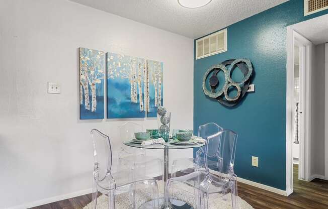 a dining room with a table and chairs