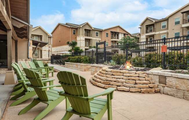 chairs and fire pit at the preserve at green valley apartments