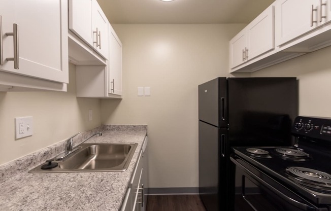 This is a photo of the kitchen in a 849 square foot split 2 bedroom, 2 bath apartment at Park Lane Apartments in Cincinnati, OH.