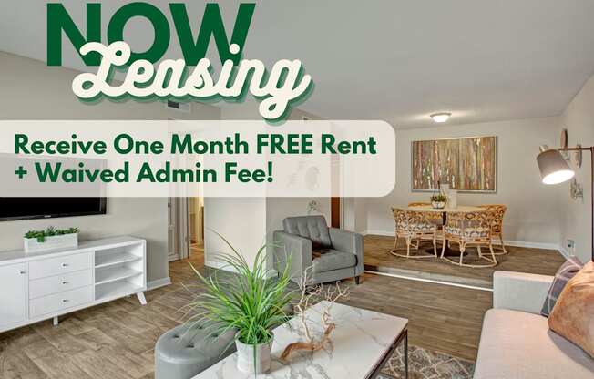 A living room with a white sofa and a coffee table with a plant on it.