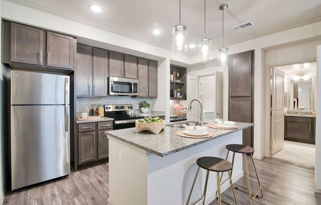Gourmet Kitchen With Island at Seville at Clay Crossing, Katy, Texas