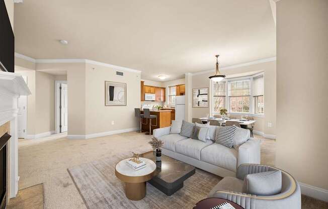 A living room with a grey couch and a coffee table.