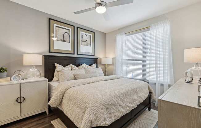 a bedroom with a bed and a ceiling fan at LynnCora, Grand Prairie, 75052
