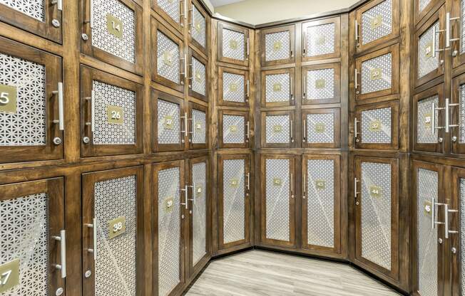 a room filled with wooden cabinets and lockers