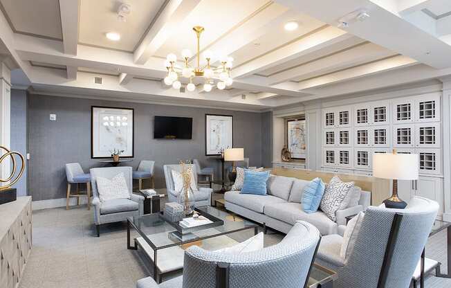 Community room with wine lockers and sofas at St Mary's Square North Apartments, Raleigh, NC, 27605