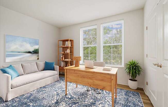 A room with a couch, a table, and a painting on the wall.