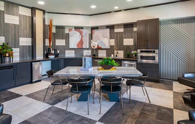 A modern kitchen with a dining table set for four.