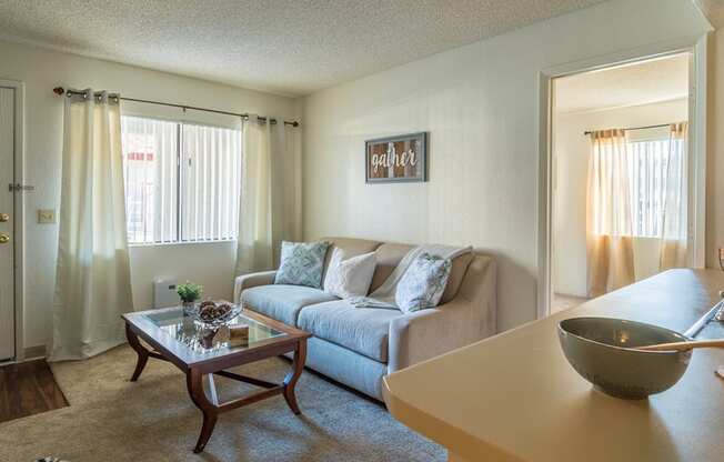 Canyon creek living room with cozy couches and plenty of natural light 