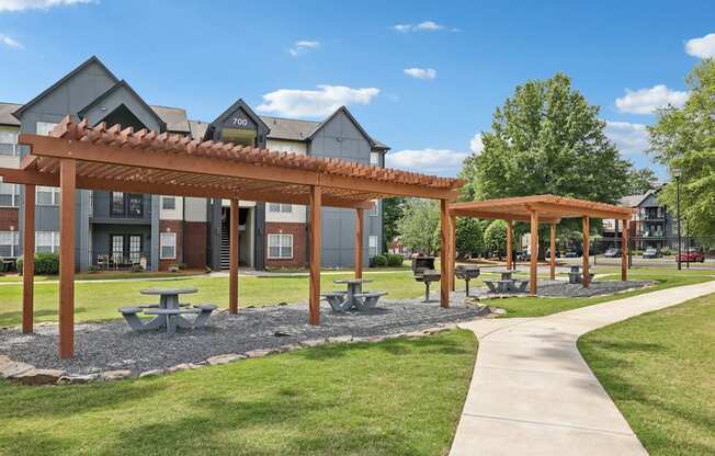 Grills and outdoor tables under pergola