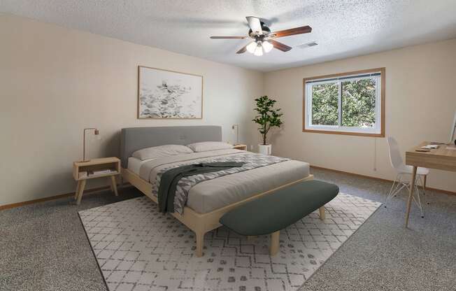 a bedroom with a bed and a ceiling fan