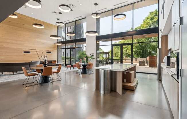A modern kitchen with a dining table and chairs.