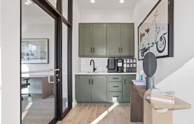 a small kitchenette with a sink and deluxe Coffee Café in the clubhouse at Sanctuary at Indian Creek