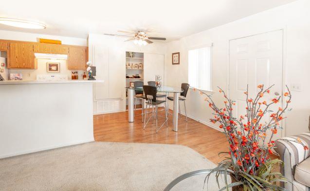 Living Room With Kitchen View at Aspen Park Apartments, Sacramento, CA