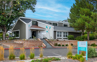 A modern building with a sign that says "Avens Point Learning Center" in front of it.