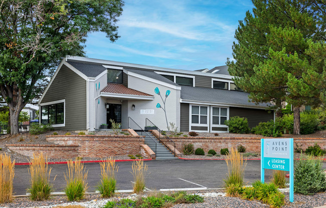 A modern building with a sign that says "Avens Point Learning Center" in front of it.