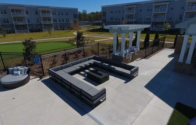 a fire pit and seating area in the middle of a building