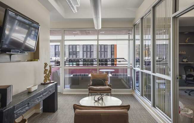 Our Apartment Building Interior Lobby overlooking the Common Area Patio at Sleek Lofts Apartments in Denver, Colorado