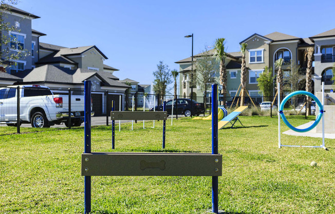 Hurdle at pet park for dogs to jump over at Lake Nona Water Mark in Orlando, FL 32827