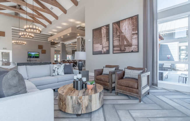 a living room with couches and chairs and a coffee table