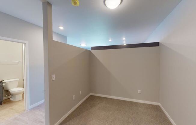 a empty room with a toilet and a sink in it