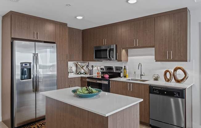 Homes include contemporary kitchens with islands and stainless steel appliances